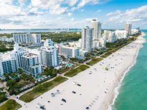 Aerial view of coastal buildings beside a South Florida beach