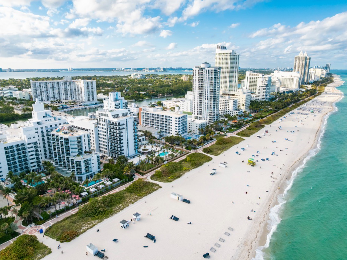 Aerial view of coastal buildings beside a South Florida beach