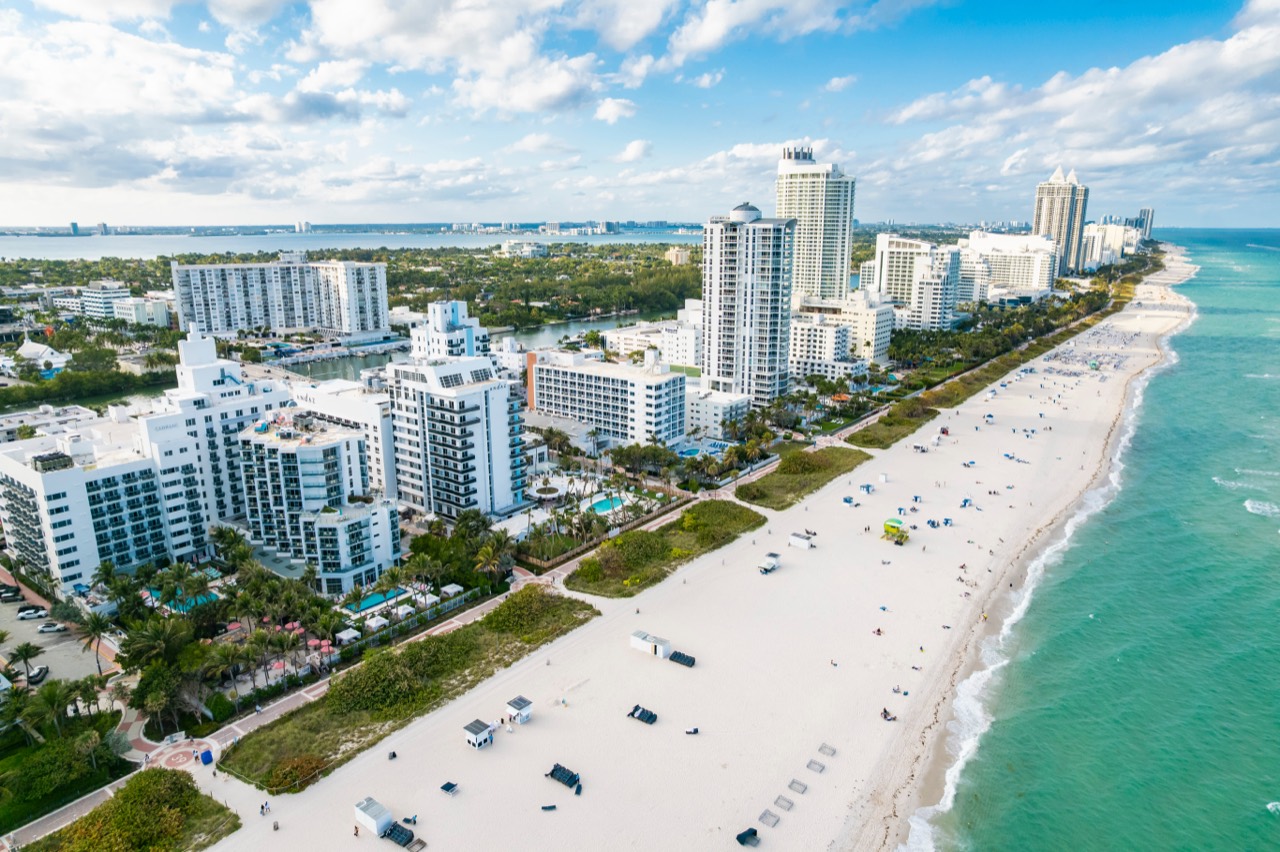Aerial view of coastal buildings beside a South Florida beach